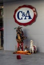 Antwerp, Belgium - Sep 18, 2016: American Red Indian playing musical instrument in front of C&A shop in Antwerp, Belgium