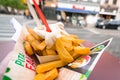 Antwerp, Belgium - 04.29.2018: Traditional belgian fries served on paper with cream sauce and plastic forks