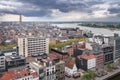 Antwerp, Belgium - 04.29.2018: View of the city from above on a cloudy, rainy day. Dramatic clouds on the horizon. River Scheldt