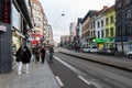 Antwerp, Flanders - Belgium - Multi cultural people walking along the bussy road and tramway tracks