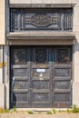 Ornate black metal door of an abandoned masnion in Antwerp city center, Belgium