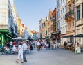 Antwerp Street with numerous passers and visitors to cafes