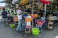 Flower sellers working in a stall at the ancient city of Anuradhapura in Sri Lanka.