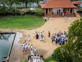 Sri Lanka students and Western tourists visithing the Isurumuni Viharaya in Anuradhapura