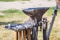 Anvil and a set of blacksmithing tools on the street_