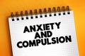 Anxiety and Compulsion text concept on notepad for presentations and reports