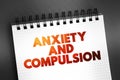 Anxiety and Compulsion text concept on notepad for presentations and reports