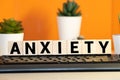 ANXIETY word written on wood block