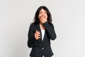 Anxious brunette teen girl screaming, look i panic, holding hand near mouth and stare nervous and distressed, standing alarmed, Royalty Free Stock Photo