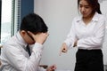 Anxious depressed young Asian business man is being blamed with boss in workplace.