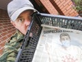 Anxious frightened man with newspaper with coronavirus news.