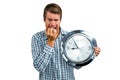 Anxious late man holding a clock Royalty Free Stock Photo
