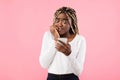 Anxious scared black woman looking at phone seeing bad news