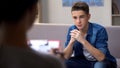 Anxious teenager visiting psychologist for personal therapy session, problems Royalty Free Stock Photo