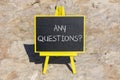 Any questions symbol. Concept words Any questions on black chalk blackboard on a beautiful stone background. Business and Any Royalty Free Stock Photo