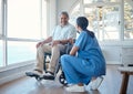 Anything special you wanna do today. Full length shot of a handsome senior man and his female nurse in the old age home.