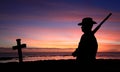 ANZAC Soldier with Cross at Sunrise