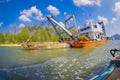 AO NANG, THAILAND - FEBRUARY 09, 2018: Outdoor view of huge boat with a ramp, sailing in the river at with a blurred