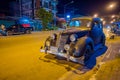 AO NANG, THAILAND - FEBRUARY 09, 2018: Outdoor view of old clasic black car parked in the streets during night in AO