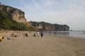 AO NANG, THAILAND, FEBRUARY 10, 2015 : Tourists enjoying the beautiful and wide Railay West beach surrounded by awesome cliffs in Royalty Free Stock Photo