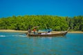 AO NANG, THAILAND - MARCH 05, 2018: Outdoor view of unidentified people traveling in Fishing thai boats in the river at