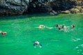 AO NANG, THAILAND - MARCH 05, 2018: Tourists relaxing and swimming in the turquoise water at chicken island in Thailand