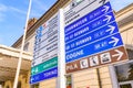 Aosta, Italy. In front of the Aosta railway station, a group of road signs.