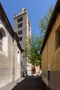 Aosta, Italy. View of the Bell Tower and the entrance to the Collegiate Church of Ss. Pietro and Orso. Vertical image.