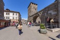 Aosta, Italy. View of the remains of the ancient praetorian gate with some tourists visiting the city.