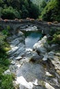 Aosta Valley, Italy - The ancient Roman bridge over the river in the little village named  Pontboset Royalty Free Stock Photo