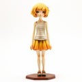 Anime Figure With Orange Hair On Wooden Background