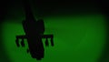 Apache AH-64 helicopter flies at night, night vision infrared Royalty Free Stock Photo