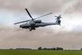 An Apache helicopter flies away to gilze