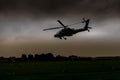 An Apache helicopter flies away to gilze