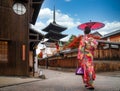 Apanese girl walk in kyoto old market and wooded yasaka pagoda Royalty Free Stock Photo