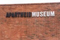 Apartheid Museum Johannesburg - outer wall made of brick with a black and white sign \