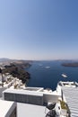Apartment balcony in a white luxurious resort with great views of the Santorini Island shore