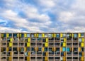 Apartment block facade with balconies and colourful windows Royalty Free Stock Photo