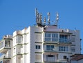 Apartment block, with radio, antennae and mobile masts. Royalty Free Stock Photo