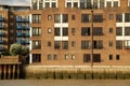 Apartment block situated along the scenic Thames River in London Royalty Free Stock Photo