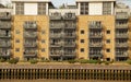 Apartment block situated along the scenic Thames River in London Royalty Free Stock Photo