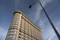 Apartment building against blue sky and a street light pole Royalty Free Stock Photo