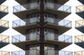 Apartment building concrete and glass balcony symmetrical mirror effect residential skyscraper Royalty Free Stock Photo