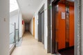 Apartment building corridor with open elevator and staircase view Royalty Free Stock Photo