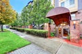 Apartment Building entrance, red brick columns with lanterns . Royalty Free Stock Photo