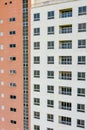 Apartment building exterior with sloughing paint on the wall