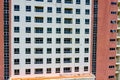 Apartment building exterior with sloughing paint on the wall