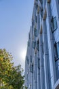 Apartment building in a low angle view with glass wall claddings and casement windows