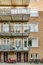 an apartment building with a red scooter parked outside Royalty Free Stock Photo