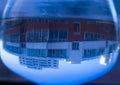 A building reflected in a drop of water